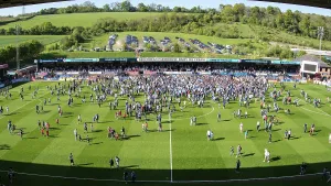 Trending: Fans celebrate promotion on the pitch