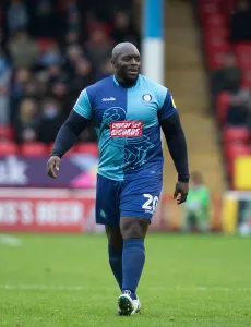 Wwfc Prints: The Unstoppable Power Clash: Adebayo Akinfenwa vs Walsall at Wycombe Wanderers